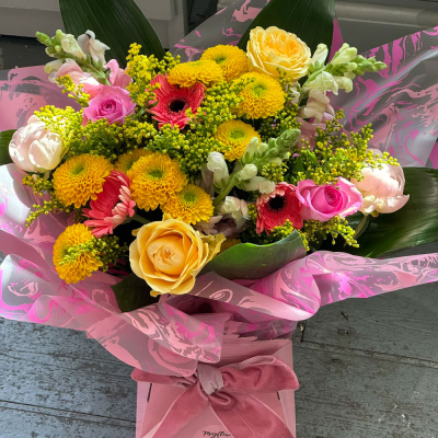 Sunrise - Energise their day with a stunning surprise. A warm collection of seasonal flowers artistically arranged by an artistic florist. Available for same day delivery when ordered before 2pm.