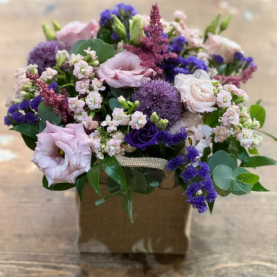 A Little Something - Show your affection with this mouth-watering mix of classical flowers delivered in a delightful gift bag or box.