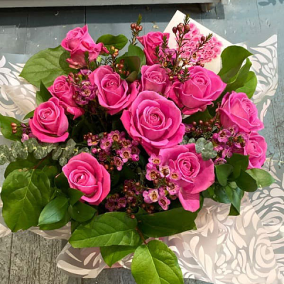 Dreamy Dozen - A sensational array of roses hand-tied and beautifully presented. This star of the florist just demands adoration and is sure to wow the recipient.