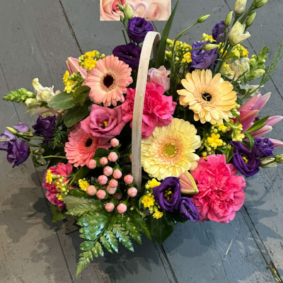 Bon Bon - Shower them with love with this cutesy collection of seasonal flowers in pretty pastels. Beautifully arranged and stylishly presented in a traditional basket.